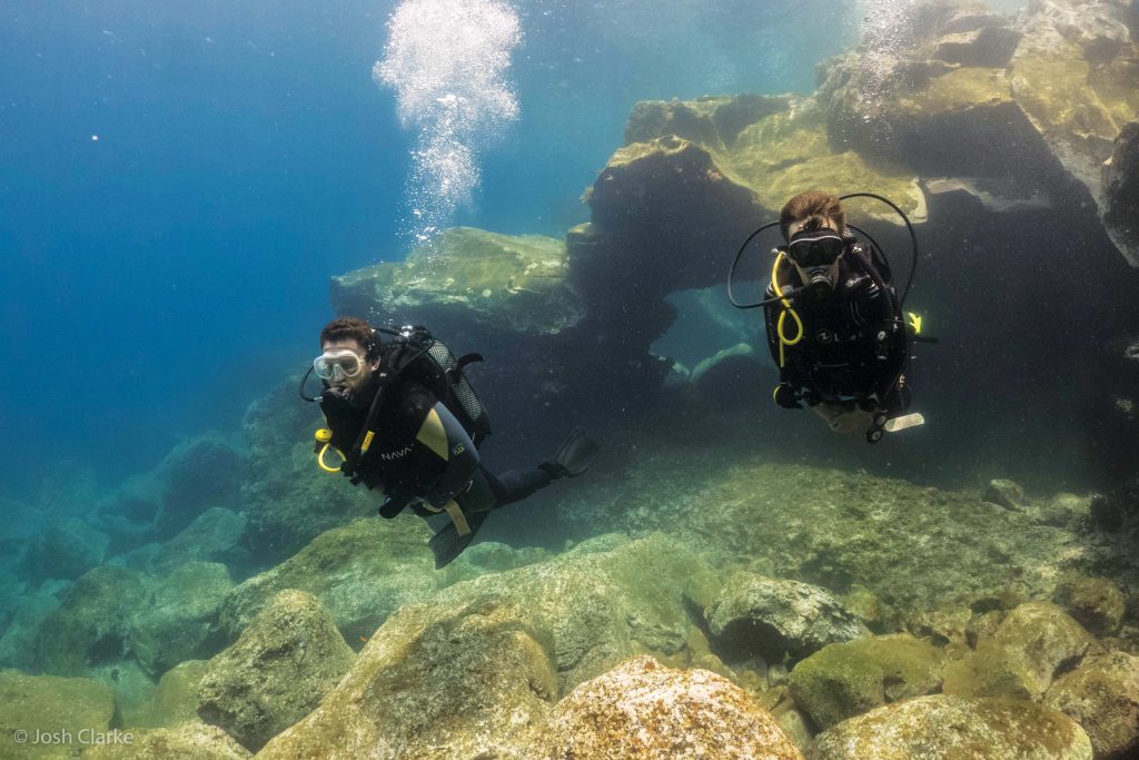 Two people scuba diving 