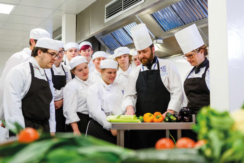 Chef cooking with students